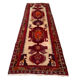 Hand-Knotted Caucasian-Style Wool Runner with Geometric Motifs: This hand-knotted wool runner features a traditional Caucasian-style design, characterized by bold geometric patterns in a rich palette of red, cream, orange, and blue. The central field showcases a s