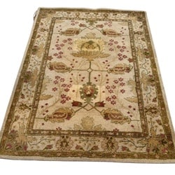 Hand-Tufted Wool Area Rug with Traditional Floral Design: This hand-tufted wool area rug features a traditional floral design in shades of cream, beige, green, and muted red. The central medallion is surrounded by an intricate field of scrolling vines and