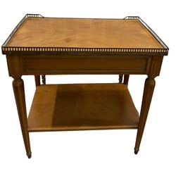 French Louis XVI Style Marquetry Inlaid End Table with Brass Gallery Rail: This elegant French Louis XVI style end table features exquisite marquetry inlay on the top and lower shelf, creating a sophisticated geometric pattern. The table is crafted from possibly fruitwood