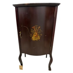 Musical Motif Mahogany Finish Record Cabinet: This vintage record cabinet, likely from the mid-20th century, features a rich mahogany finish and delicate hand-painted musical instrument motifs on its front door. The cabinet stands on elegant