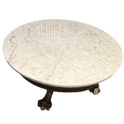 Italian Neoclassical Style Marble-Top Center Table: An Italian Neoclassical style center table, likely late 19th or early 20th century. The table features a circular white marble top with prominent grey veining, resting on an elaborately carved wooden