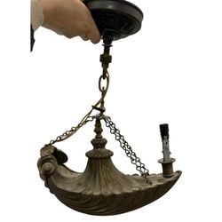 Antique Arts and Crafts Style Brass Chandelier with Shell Motif: This antique chandelier, crafted in the Arts and Crafts style, features a warm patinated brass finish. The main body of the chandelier is a shallow bowl shape with a distinctive fluted, shell-like