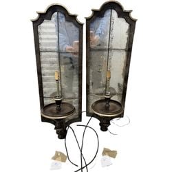 Pair of Mirrored Sconces in the Venetian Taste #1: A pair of decorative sconces, likely mid-20th century, crafted in a style reminiscent of Venetian mirrors. Each sconce features an antiqued mirror panel set within a shaped, patinated dark wood or