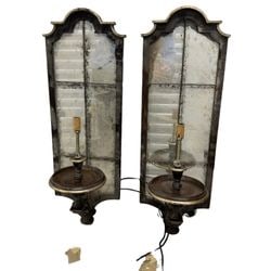 Pair of Monumental Gilt Wood and Antiqued Mirror Sconces #3: A striking pair of monumental gilt wood and antiqued mirror wall sconces, likely mid-20th century, executed in a Hollywood Regency style. Each sconce features a tall, arched mirror panel with an