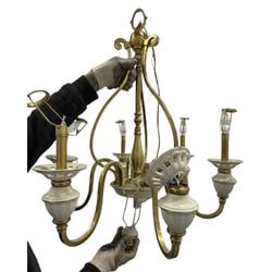 Vintage Brass and Ceramic Five-Light Chandelier: A charming vintage five-light chandelier, likely dating from the mid-20th century. The chandelier features a polished brass frame with five gracefully curved arms, each terminating in a light