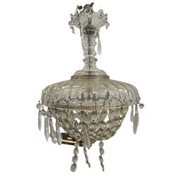 Vintage Crystal Chandelier: This elegant vintage crystal chandelier features a clear glass body with a ribbed, domed top section and a bowl-shaped lower section adorned with numerous cut crystal prisms and faceted crystal
