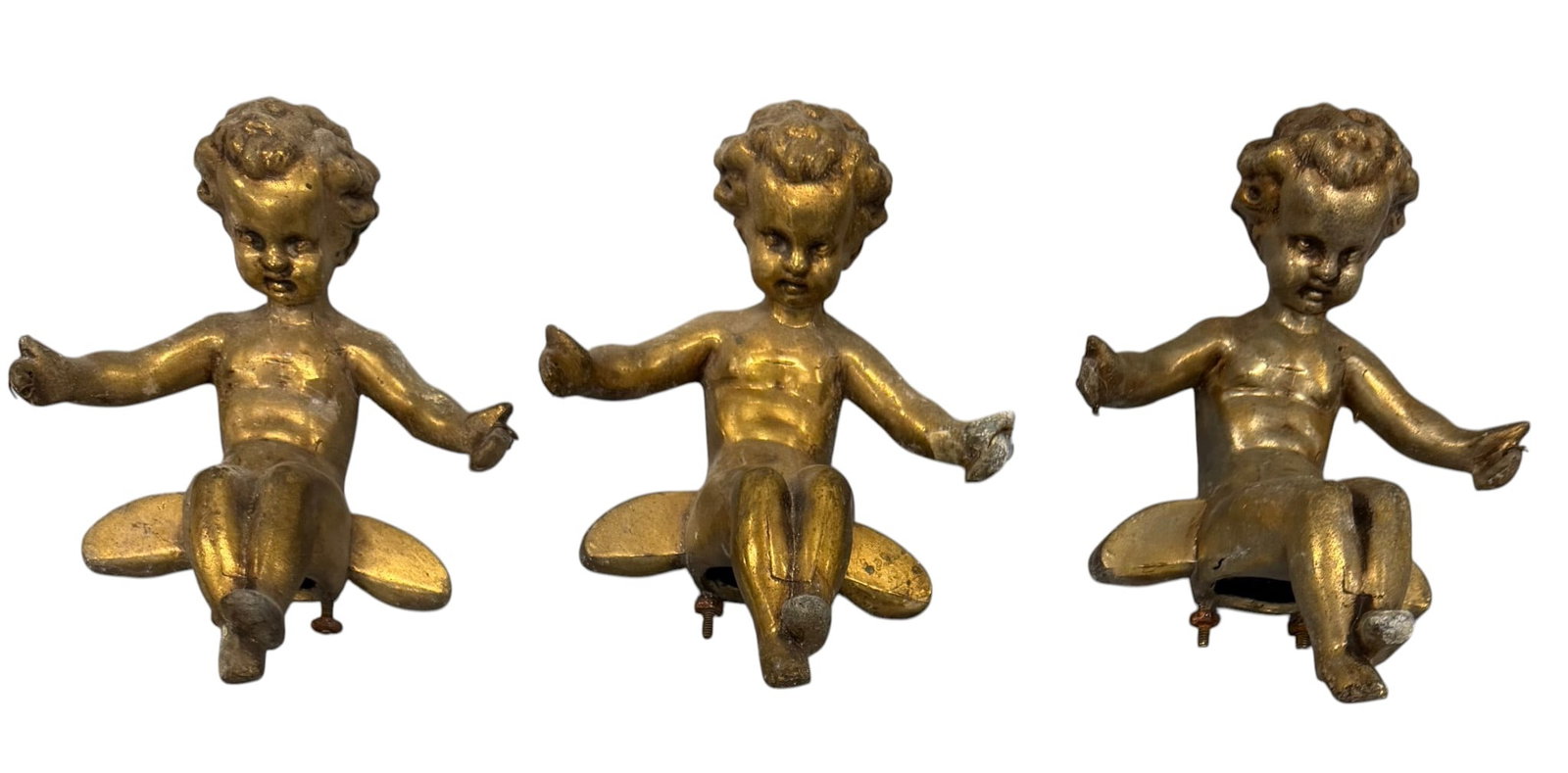Set of Three Giltwood Cherubs/Putti: A charming set of three giltwood cherubs or putti, likely from the Rococo or Baroque revival period, late 19th or early 20th century. Each figure is depicted in a seated or reclining pose with outstre