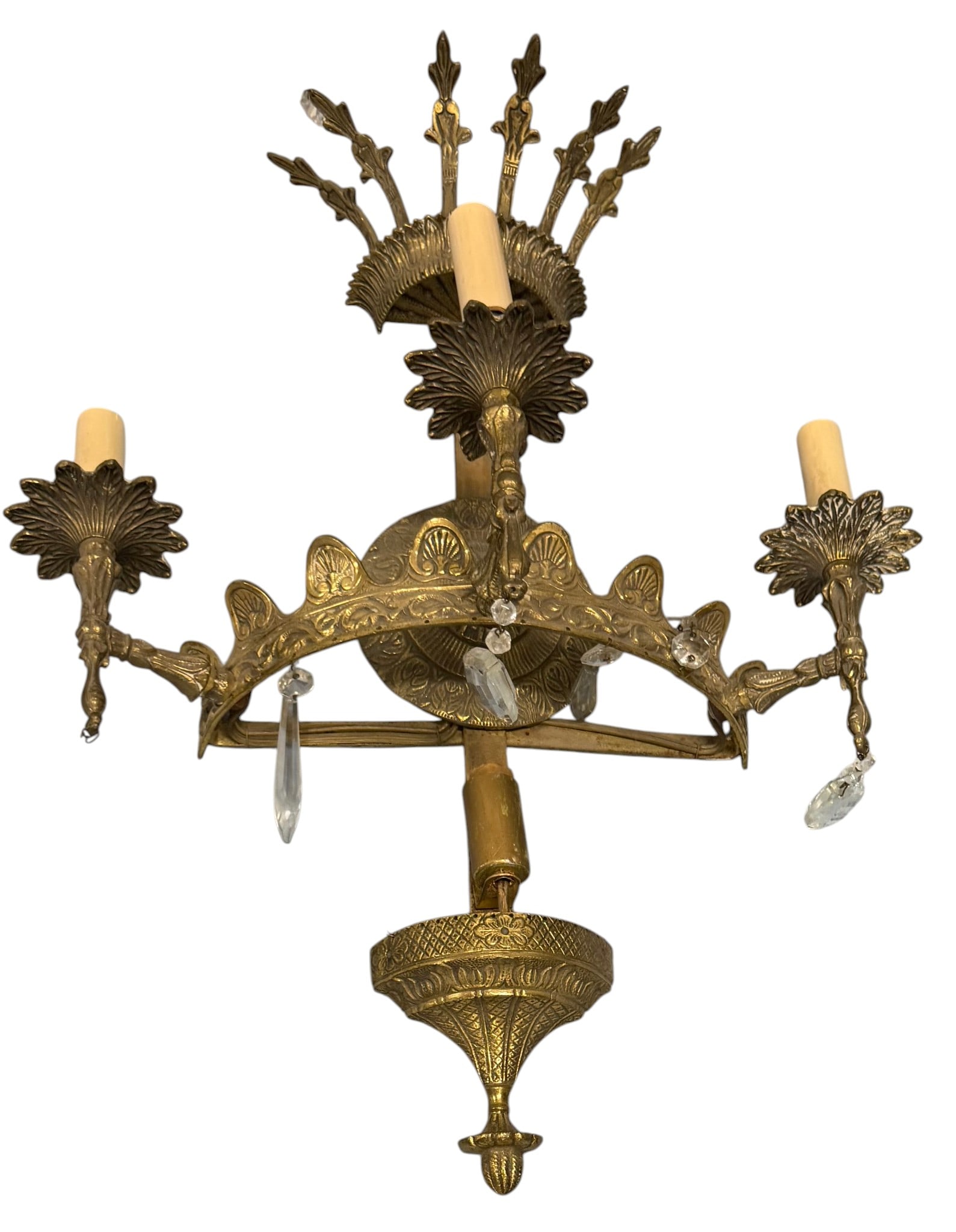 Gilded Brass and Crystal Three-Light Sconce: This ornate gilded brass sconce features three candle-style lights, reminiscent of Rococo or Neoclassical design. The central stem is adorned with a decorative crown-like finial at the top and a