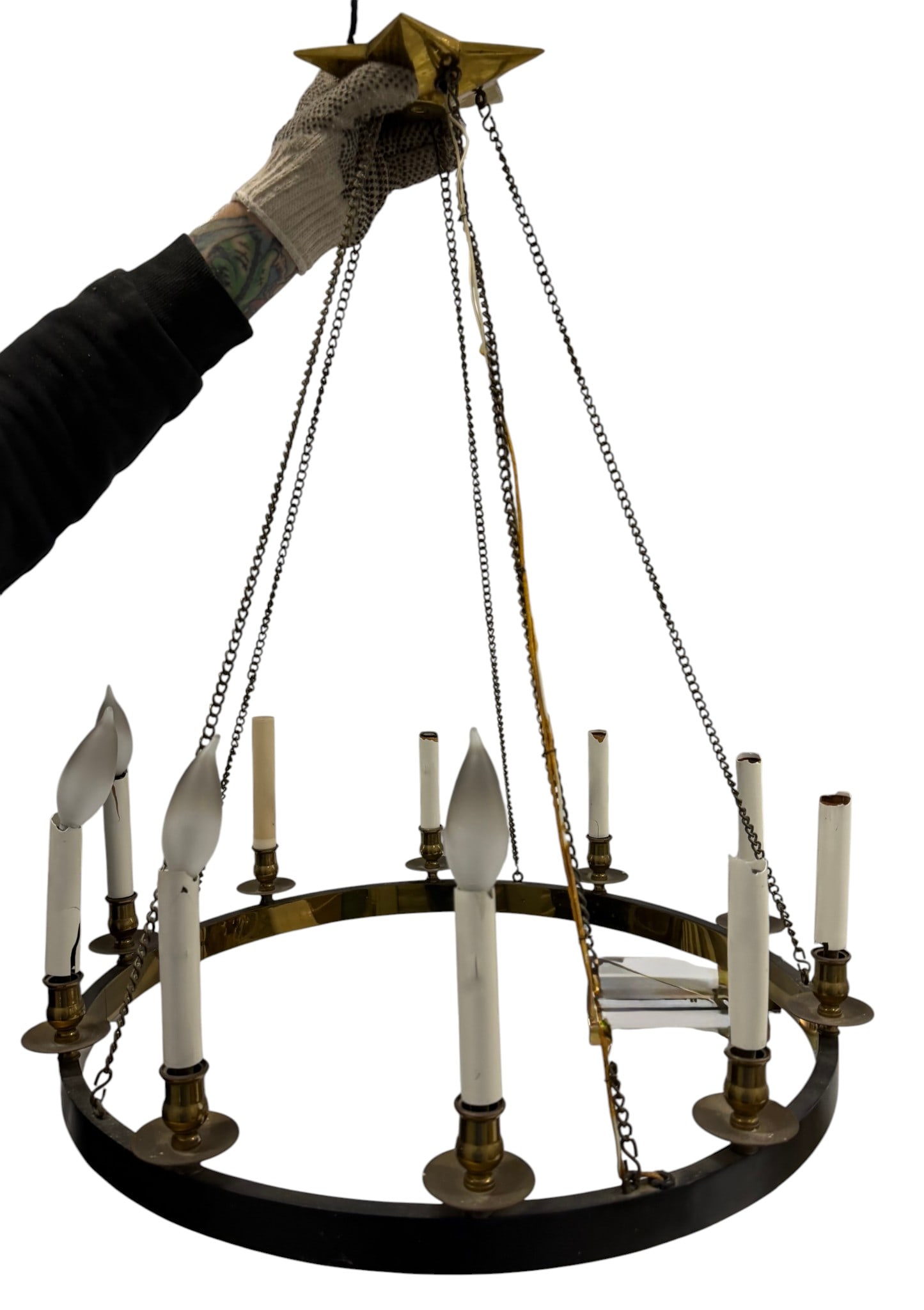 Large Brass and Wrought Iron Chandelier: An impressive large chandelier featuring a central wrought iron ring adorned with twelve brass candle arms, each supporting an E12 candelabra base socket. The fixture is suspended by multiple chains