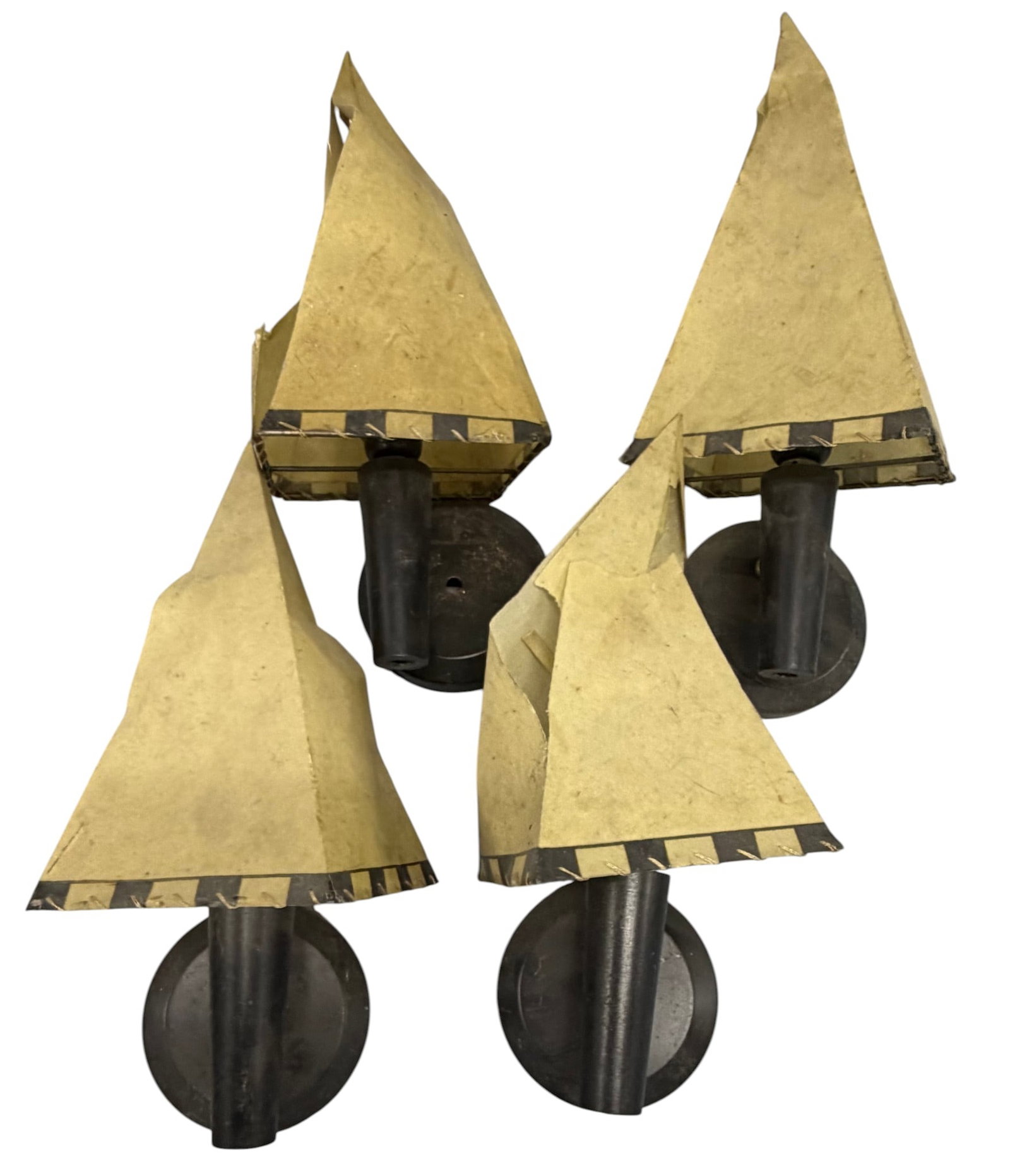 Set of Four Arts and Crafts Style Wall Sconces: This set of four wall sconces features an Arts and Crafts style, likely dating from the mid-20th century. Each sconce is constructed with a dark patinated metal base and arm, holding a pyramidal,