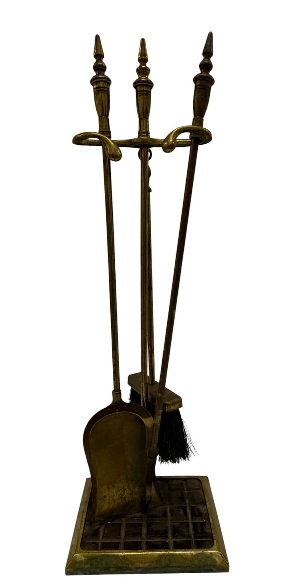 Vintage Brass Fireplace Tool Set: A vintage brass fireplace tool set, likely from the Mid-20th Century, featuring a classic design suitable for various traditional interior styles. The set includes a stand with a distinctive grid