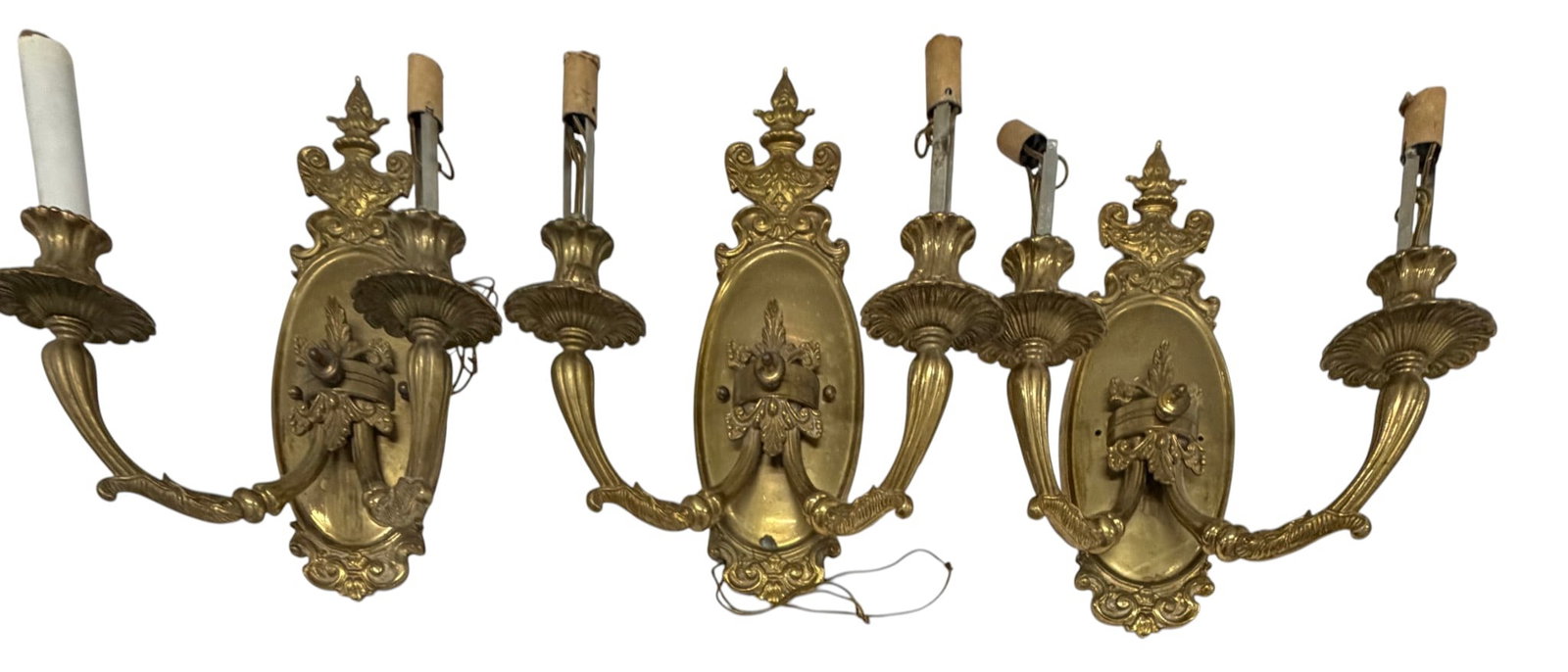 Set of 3 Rococo Revival Gilt Bronze Sconces: A set of 3 of Rococo Revival gilt bronze two-light sconces. Each features an ornate backplate with scrolled acanthus leaf motifs, supporting two S-curved arms terminating in cupped bobeches and