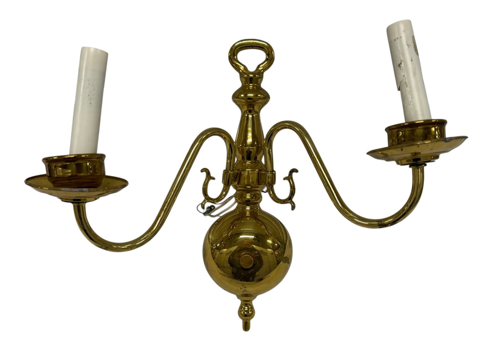 Pair of Ornate Polished Brass Two-Arm Sconces: This lot features a pair of traditional two-arm sconces crafted from polished brass, exhibiting a classic aesthetic reminiscent of 18th or 19th-century Federalist or Colonial Revival styles. Each scon