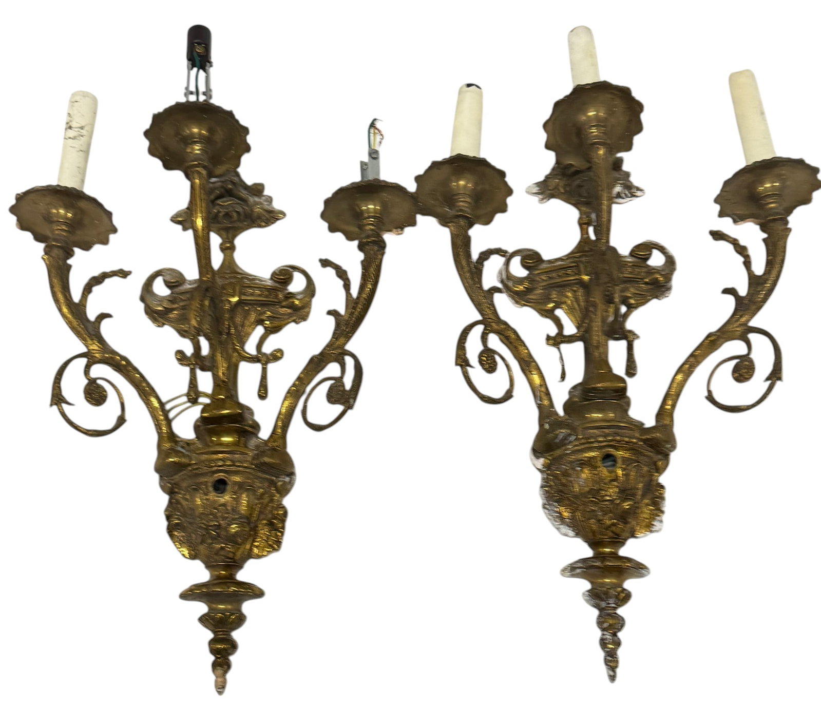 Pair of Ornate Gilt Bronze Rococo Style Wall Sconces: This is a very ornate pair of gilt bronze wall sconces, likely dating from the early to mid 20th century, executed in the Rococo style. Each sconce features three lights with candle-form covers and hi