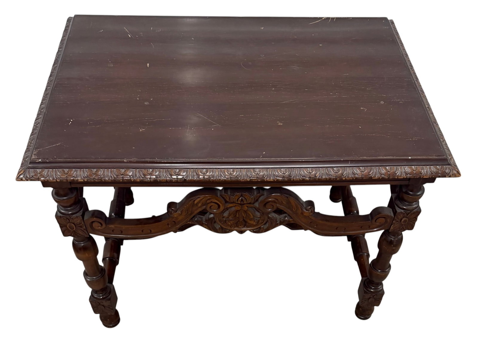 Carved Dark Wood Coffee Table: This is a heavily carved dark wood coffee table, possibly oak or mahogany, from the late 19th or early 20th century, likely in the Baroque or Renaissance Revival style. The rectangular top sits on a