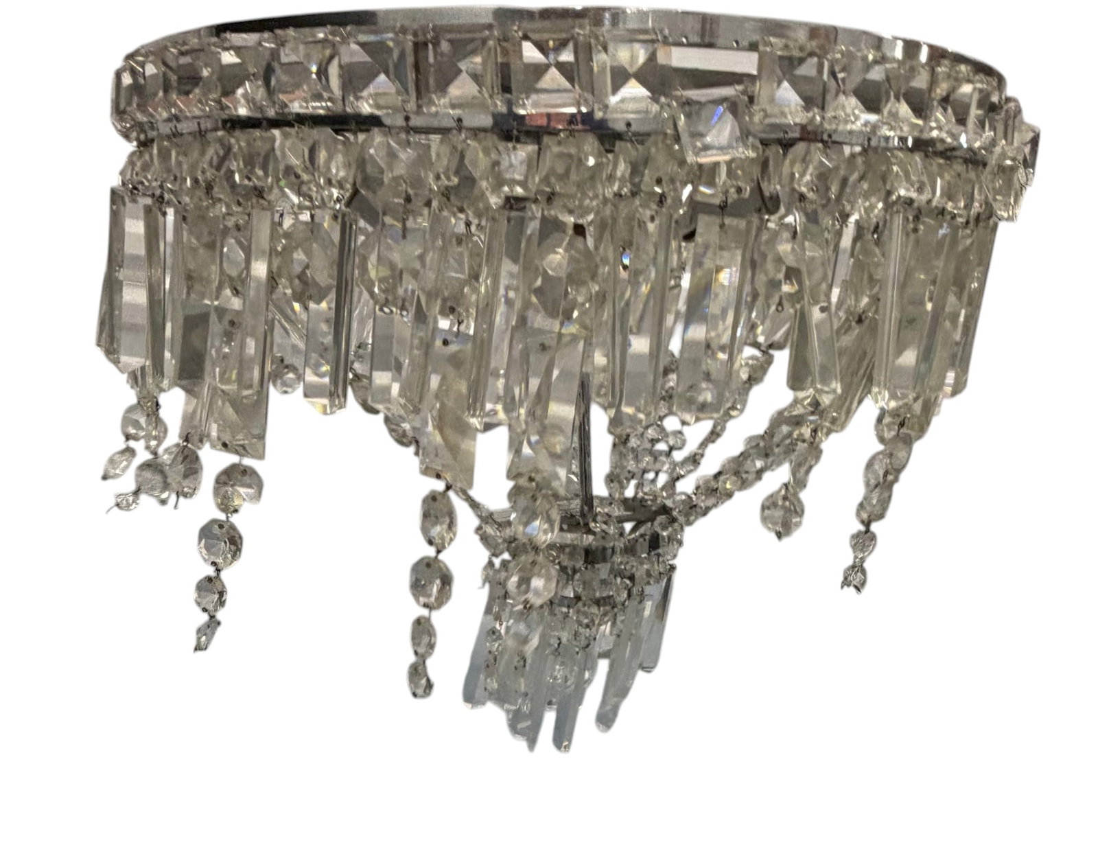 Crystal Chandelier: A striking crystal chandelier, likely mid-20th century, featuring multiple tiers of faceted clear crystal prisms and beaded chains suspended from a chrome-plated frame. The design evokes a classic
