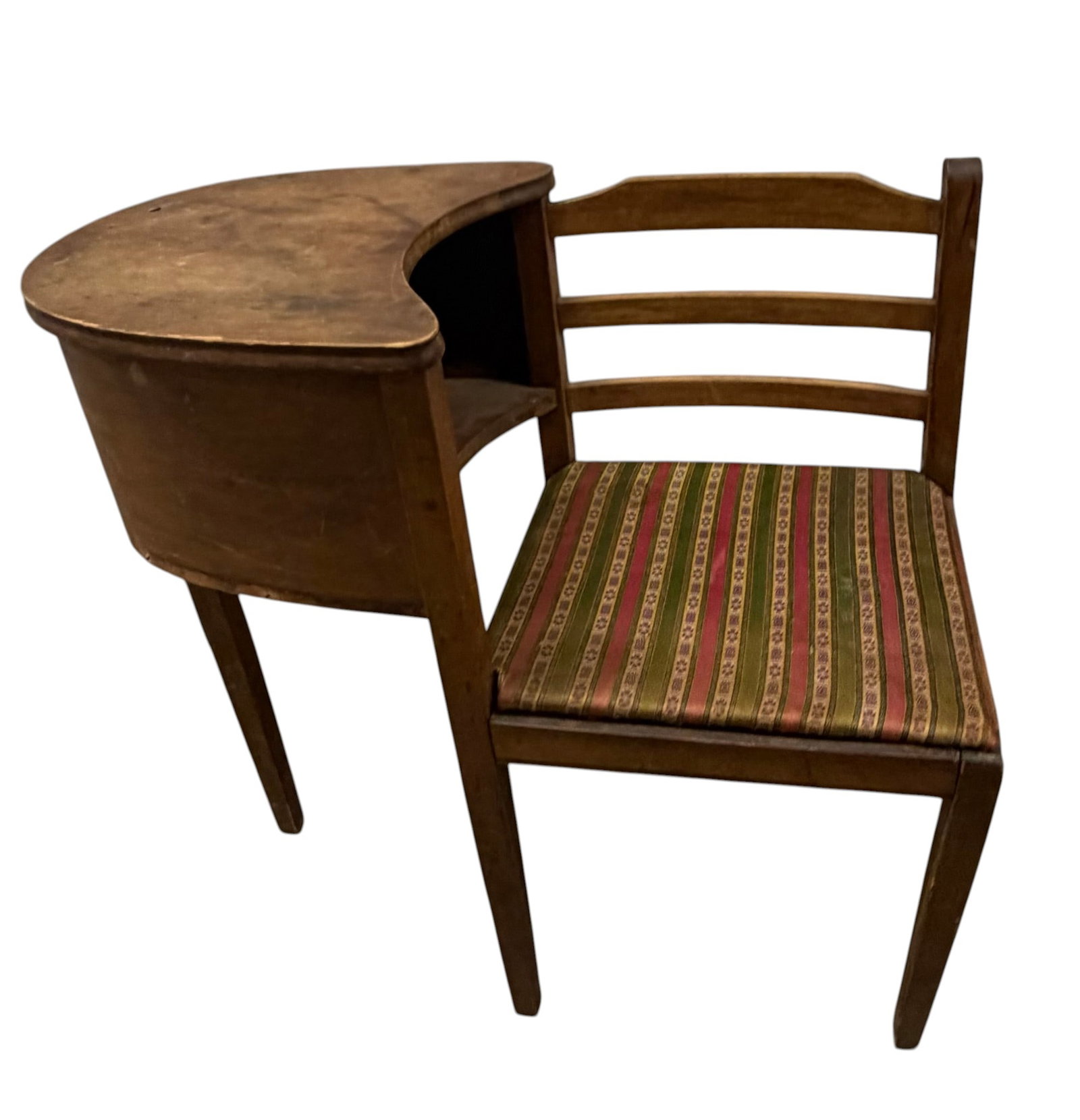 Antique Wooden Telephone Table with Attached Chair: An antique wooden telephone table with an attached chair, likely dating from the early to mid-20th century. The piece features a crescent-shaped tabletop with a small integrated shelf below, ideal