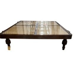 Arthur Umanoff Style Cane and Wood Coffee Table: A sophisticated coffee table crafted in the style of Arthur Umanoff, featuring an attractive dark wood frame with stepped edge detailing. The tabletop is composed of four individual cane panels, each