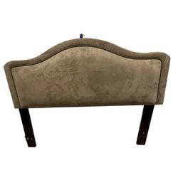 Queen Size Upholstered Headboard with Nailhead Trim: An elegant queen-size upholstered headboard featuring a gracefully curved silhouette and rich nailhead trim. The headboard is covered in a soft, microsuede-like fabric in a neutral taupe or mushroom