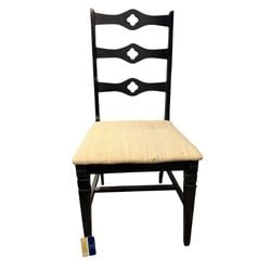 Gothic Revival Style Black Painted Side Chair: This side chair features a Gothic Revival style, evident in its quatrefoil carved back splats and dark finish. The chair is constructed from wood, likely painted black, with intricate carving details