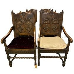 Set of Eight Carved Oak Renaissance Revival Dining Chairs: This is a set of eight Renaissance Revival dining chairs, crafted from oak. Each chair features elaborate carving, including scrolling foliage and geometric patterns on the backrests and legs. The des