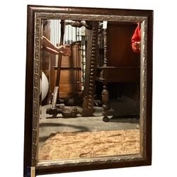 Ornate Gold and Bronze Tone Wall Mirror: This ornate rectangular wall mirror features a wide frame with a bronze-toned outer edge and a decorative gold-toned inner edge. The bronze section has a subtle texture, while the gold section is