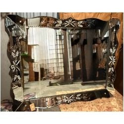 Venetian Style Etched Glass Wall Mirror: A large, ornate Venetian style wall mirror, likely dating from the mid-20th century. The mirror features a central rectangular plate surrounded by an etched glass frame with floral and foliate