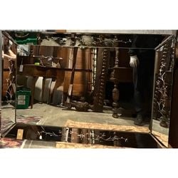 Venetian Style Etched Mirrored Glass Wall Mirror: This rectangular wall mirror is crafted in the Venetian style, featuring a mirrored frame with elegant etched floral and foliate motifs. The central mirror panel is surrounded by beveled mirror sectio