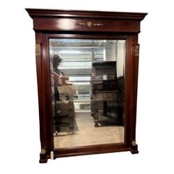 Victorian Carved Mahogany Overmantel Mirror: An impressive Victorian carved mahogany overmantel mirror, circa late 19th century. This grand mirror features a rich, dark mahogany frame with classical architectural elements. The deeply carved