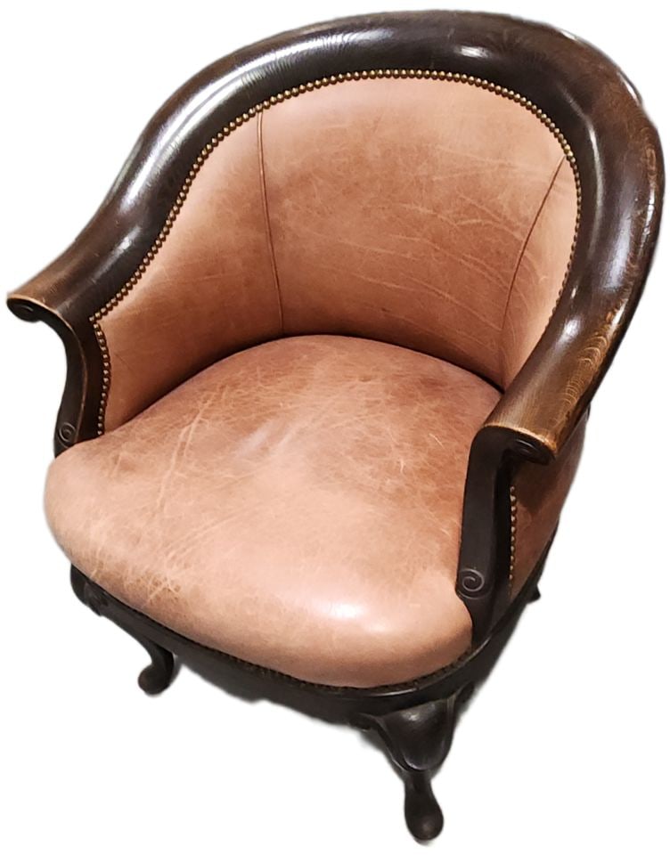 Vintage Louis XV style oversize barrel leather and wood armchair w/ brass nailhead accents: This classic barrel chair is an exemplary piece of hi-end vintage furniture, characterized by its comfortable leather upholstery and quality construction characterized by the very firm seating provide