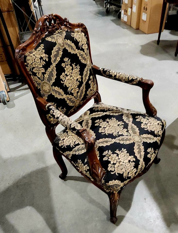 Elegant antique Louis XV style armchair w/ hand-carved ornate wood frame & distinctive upholstery.: This chair is an antique French Louis XV style armchair, also known as a fauteuil a la reine. It features a hand-carved wood frame, likely made of walnut or mahogany, decorated with ornate floral and 