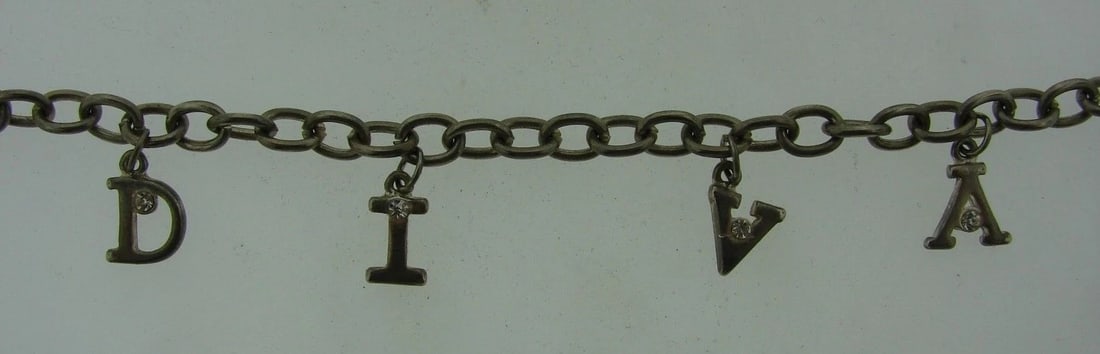 RAWR Silver & Crystal DIVA Charm Bracelet!: Title: RAWR Silver & Crystal DIVA Charm Bracelet! Description: Fine Jewelry, Arts & Antiques Purveyors and Purchasers of Antique and Estate Pieces, DKSilver & Crystal Diva Charm Bracelet! This