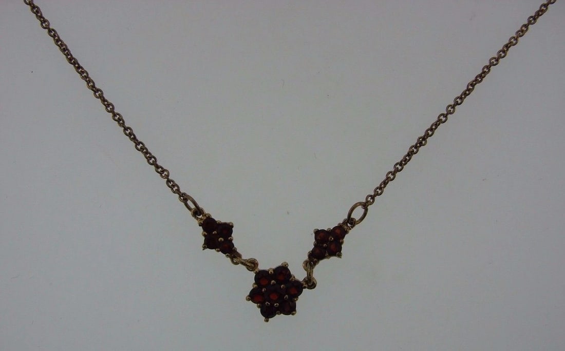 ELEGANT Sterling Silver & Garnet Necklace: Title: ELEGANT Sterling Silver & Garnet Necklace Description: DK Sterling Silver & Garnet Necklace · Wonderful necklace that is a necessity in your collection.· The weight is 4.4 grams.