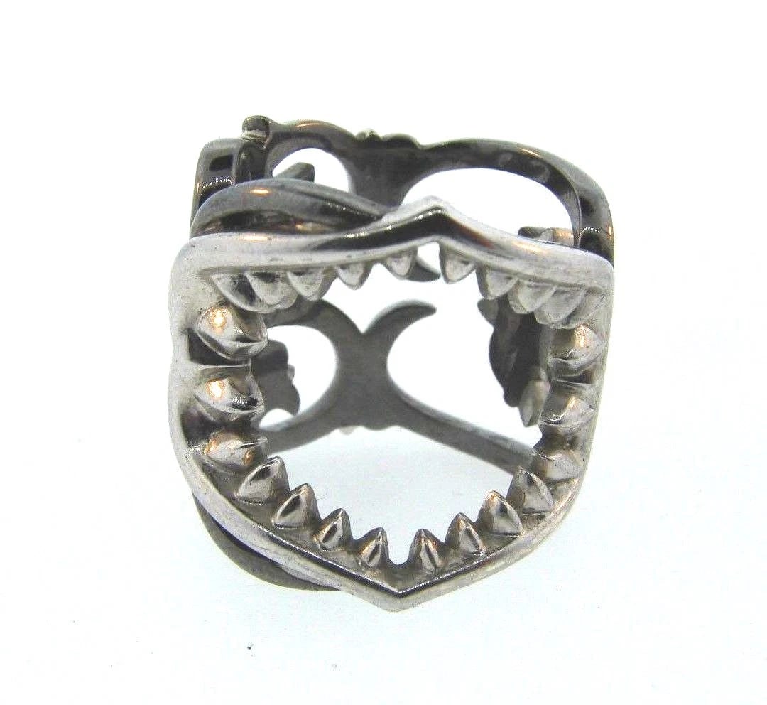 COOL Sterling Silver Ring: Title: COOL Sterling Silver Ring Description: DK Sterling Silver Ring · Wonderful ring that is a necessity in your collection.· The weight is 13.6 grams. · The height is 7/8 of an