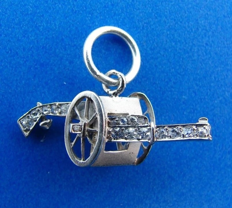 UNIQUE Platinum & Diamond Gun on Wheels Charm Antique: Title: UNIQUE Platinum & Diamond Gun on Wheels Charm Antique Description: DK Platinum & Diamond Gun on Wheels Charm Antique · This is a must for any collector. · The weight is 1 grams. The