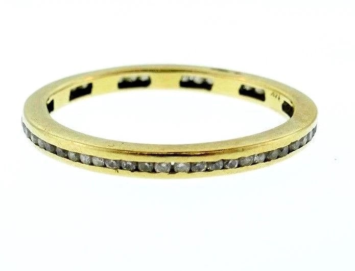 14k Yellow Gold Diamond Vintage Ring: Title: 14k Yellow Gold Diamond Vintage Ring Description: Fine Jewelry, Arts & AntiquesNS NT0 14k Yellow Gold Diamond Vintage Ring Diamonds are channel-set, I-S color, VS2-SI1 clarity, 0.60 carat.
