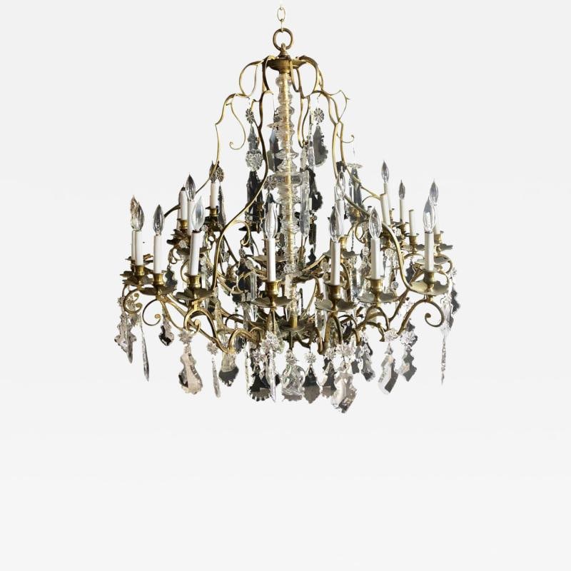 Bronze and Crystal Palatial Thirty-Light Chandelier: Title: Bronze and Crystal Palatial Thirty-Light Chandelier Description: Description 1: Bronze and crystal palatial thirty-light chandelier having a central column-form glass. This thirty-light