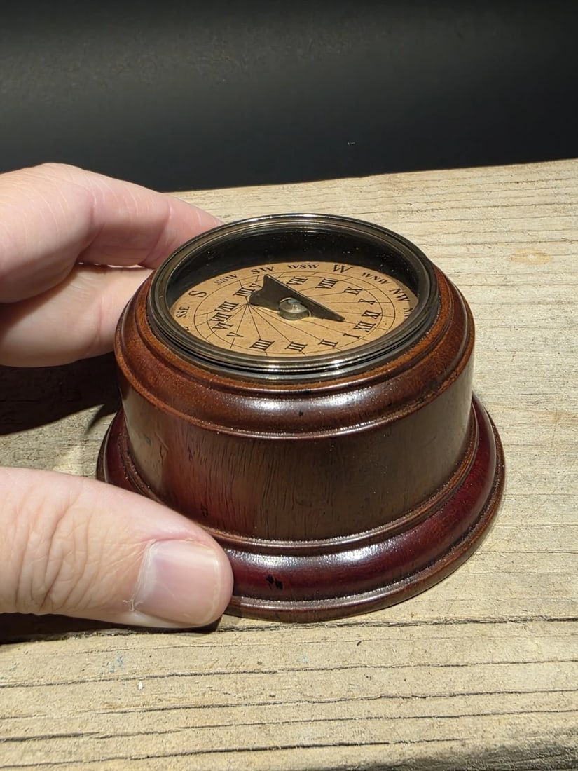 Turned Mahagony Wood Compass: Hand-Turned Mahogany Desk Compass (Reproduction) A handsome reproduction compass set into a finely hand-turned mahogany base, finished to a rich, warm tone. Fully functional and well balanced, it serv