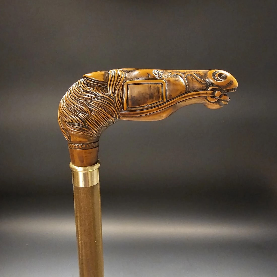 36" Horse Head Walking Stick Cane: 36" Long 3/4" shaft Introducing our beloved reproduction horse head walking cane, originating from Italy. Crafted from robust cellulose acetate, this handle sits atop a 3/4" beechwood shaft with a