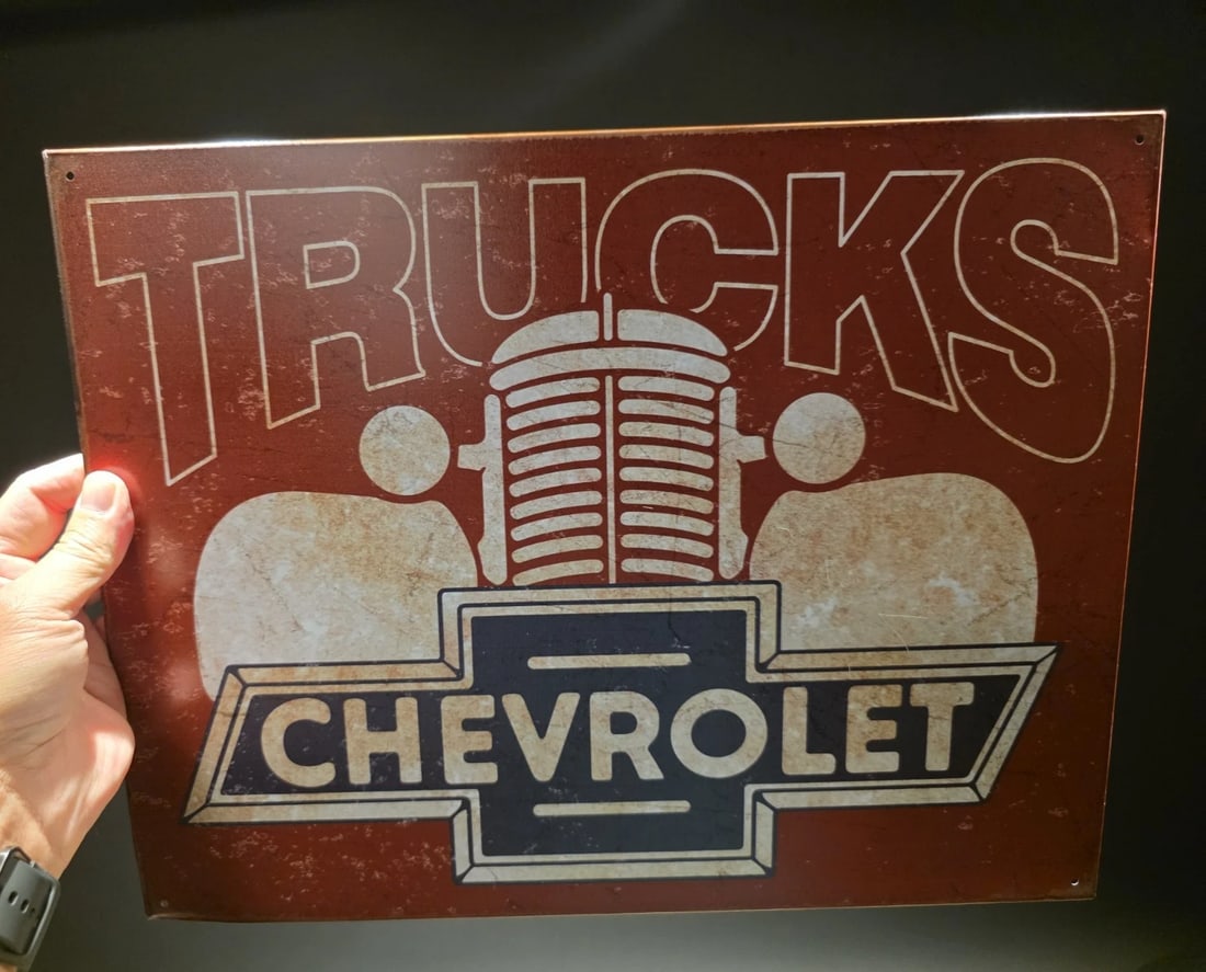 Metal Chevrolet Trucks Sign: 16" x 12 1/2" Such a neat reproduction metal Chevrolet Trucks Sign. Great decorative piece. Reserve: $12.00 Shipping: Domestic: Flat-rate of $9.00 to anywhere within the contiguous U.S.
