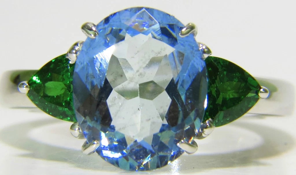 3.98CT NATURAL AQUAMARINE TSAVORITE RING MODERN 3 14KT GOLD **: Title: 3.98CT NATURAL AQUAMARINE TSAVORITE RING MODERN 3 14KT GOLD ** Description: MAGNIFICENT JEWELS 3.00ct. Natural Aquamarine Clean clarity Transparent 11mm X 9mm Side tsavorites: .98ct. Vivid