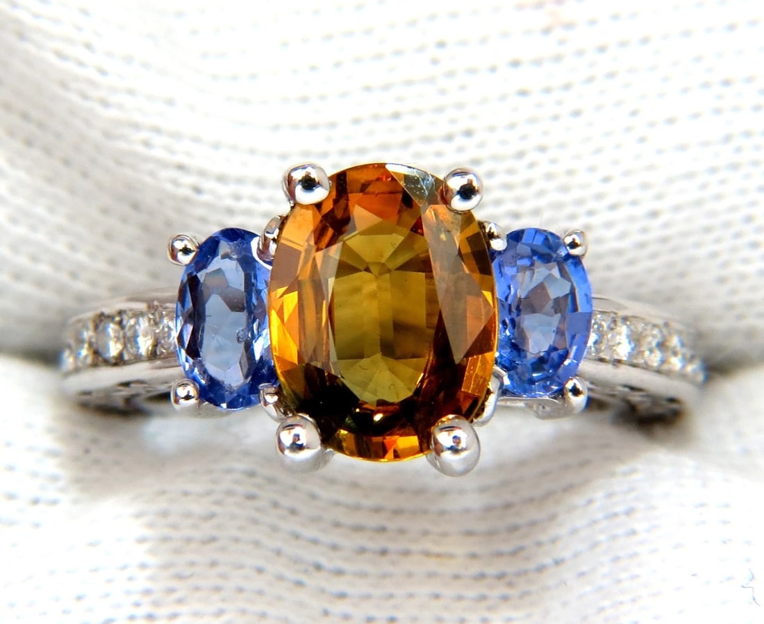 3.68CT NATURAL FANCY VIVID YELLOW BROWN SAPPHIRE TANZANITE DIAMONDS RING 14KT**: Title: 3.68CT NATURAL FANCY VIVID YELLOW BROWN SAPPHIRE TANZANITE DIAMONDS RING 14KT** Description: 2.28ct Natural Sapphire & Tanzanite ring. Sapphire of beautiful Fancy Vivid Yellow Brown. VS- Clean 