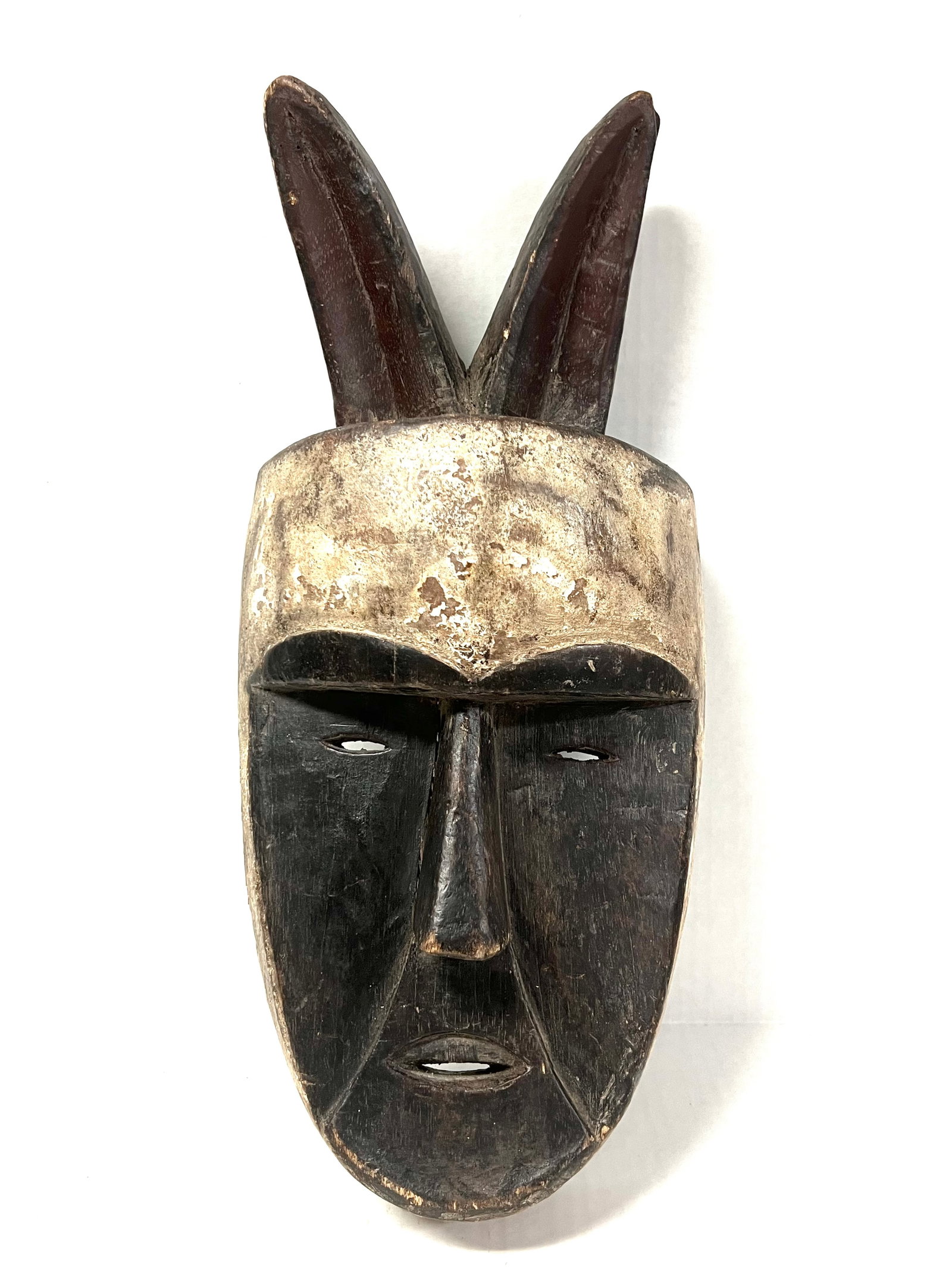 Aduma Mask: Title: Aduma Mask Description: African Tribal Art Carved Wood Aduma Mask Materials: Wood Date/Period: Late 20th Century Size: 17" h x 6" w Reserve: $160.00 Shipping: Domestic: Flat-rate of $30.00 to