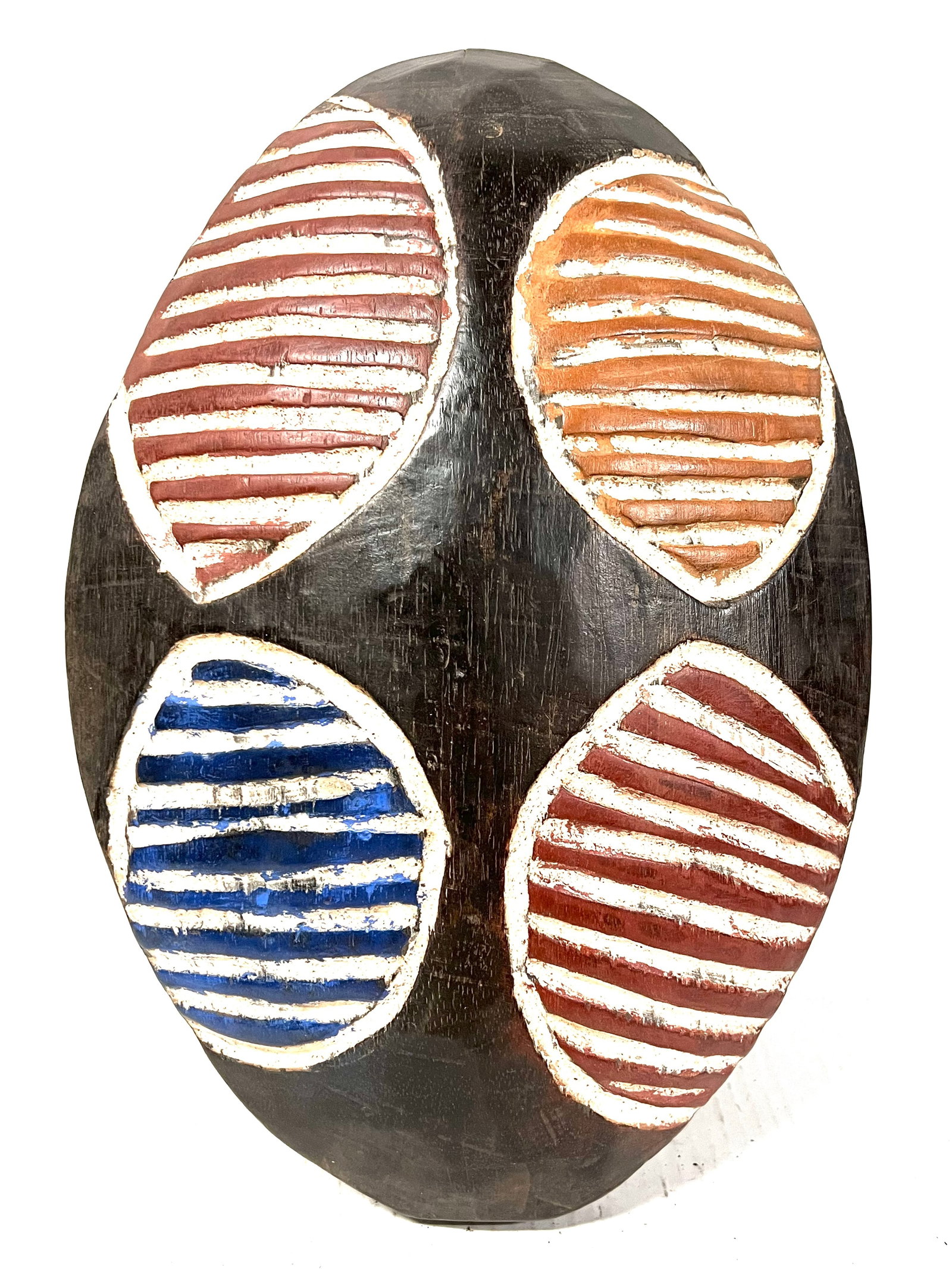 Zulu Shield: Title: Zulu Shield Description: African Tribal Art Carved Wood Zulu Shield Materials: Wood Date/Period: Late 20th Century Size: 16" h x 10.5" w Reserve: $180.00 Shipping: Domestic: Flat-rate of