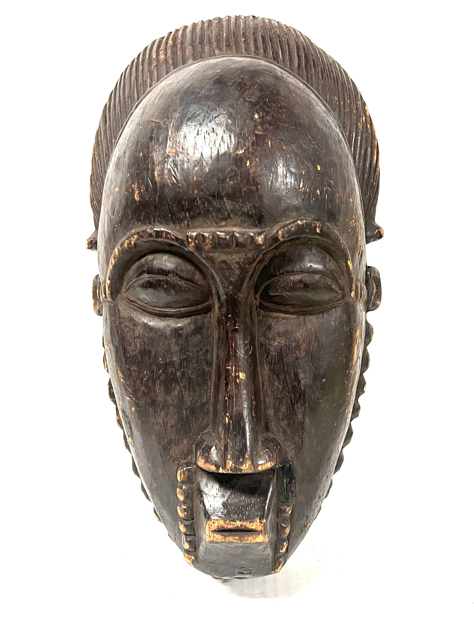 Baule Mask: Title: Baule Mask Description: African Tribal Art Carved Wood Baule Mask Materials: Wood Date/Period: Late 20th Century Size: 13.5" h x 7.5" w Reserve: $200.00 Shipping: Domestic: Flat-rate of $30.00