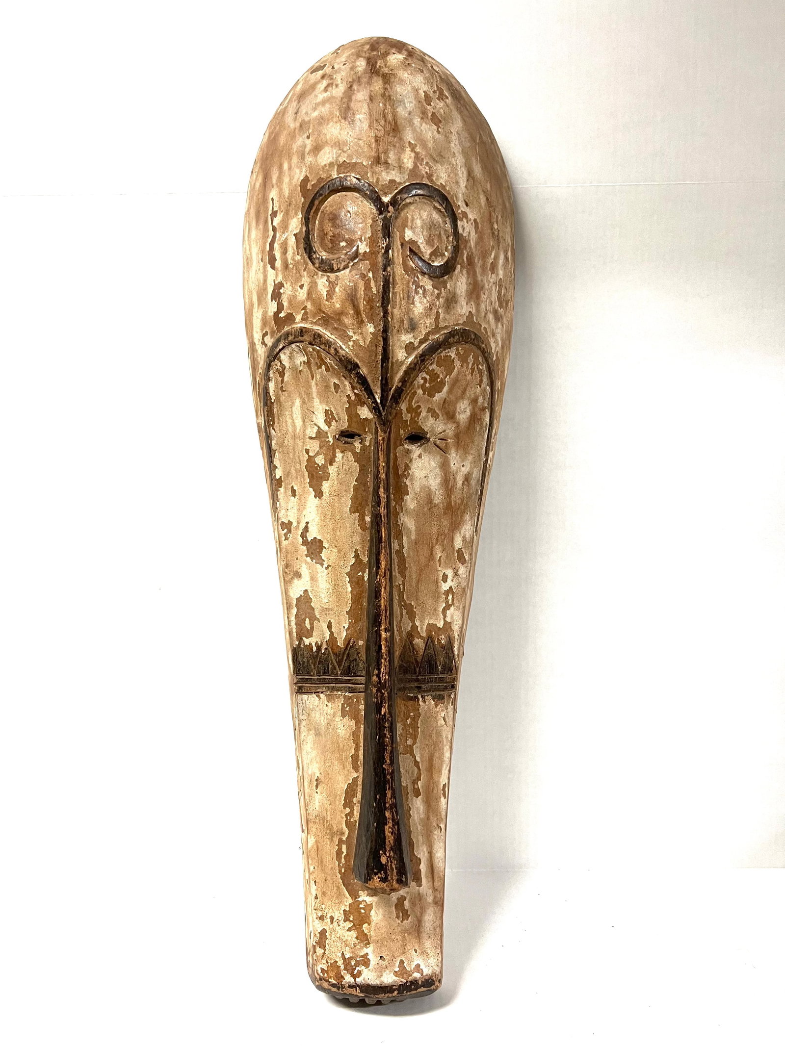 Fang Mask: Title: Fang Mask Description: African Tribal Art Carved Wood Fang Mask Materials: Wood Date/Period: Late 20th Century Size: 29" h x 9" w Reserve: $200.00 Shipping: Domestic: Flat-rate of $40.00 to