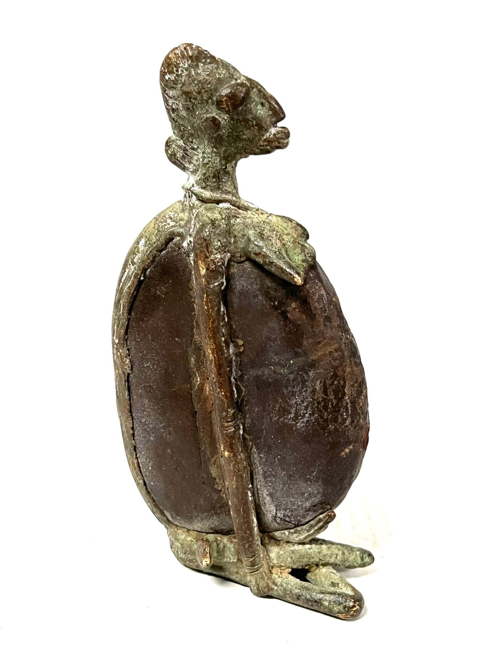 Bronze Dogon Statue: Title: Bronze Dogon Statue Description: African Tribal Art Bronze dogon Statue Materials: Bronze Date/Period: Late 20th Century Size: 7" h x 3.5" w Reserve: $180.00 Shipping: Domestic: Flat-rate of