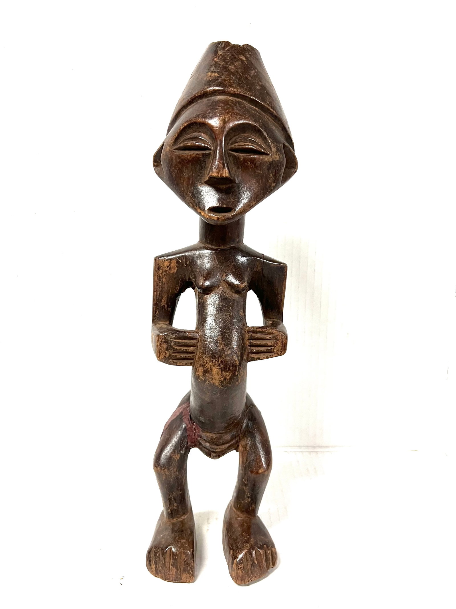 Kuba Statue: Title: Kuba Statue Description: African Tribal Art Carved Wood Kuba Statue Materials: Wood Date/Period: Late 20th Century Size: 16" h x 4.5" w Reserve: $160.00 Shipping: Domestic: Flat-rate of $30.00