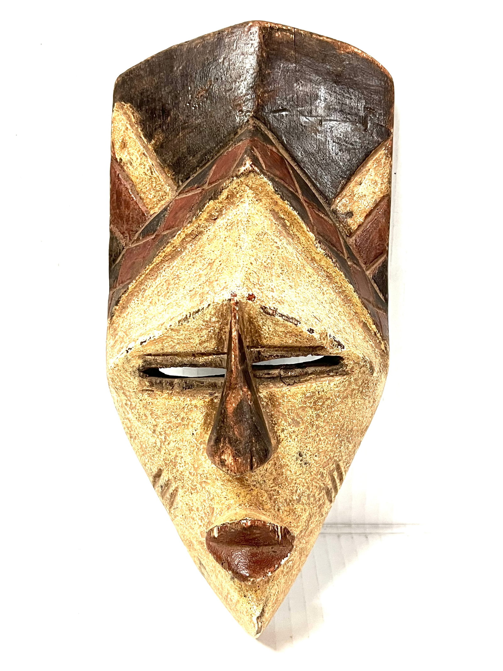 Tikar Mask: Title: Tikar Mask Description: African Tribal Art Carved Wood Tikar Mask Materials: Wood Date/Period: Late 20th Century Size: 11.5' h x 5.5" w Reserve: $160.00 Shipping: Domestic: Flat-rate of $30.00