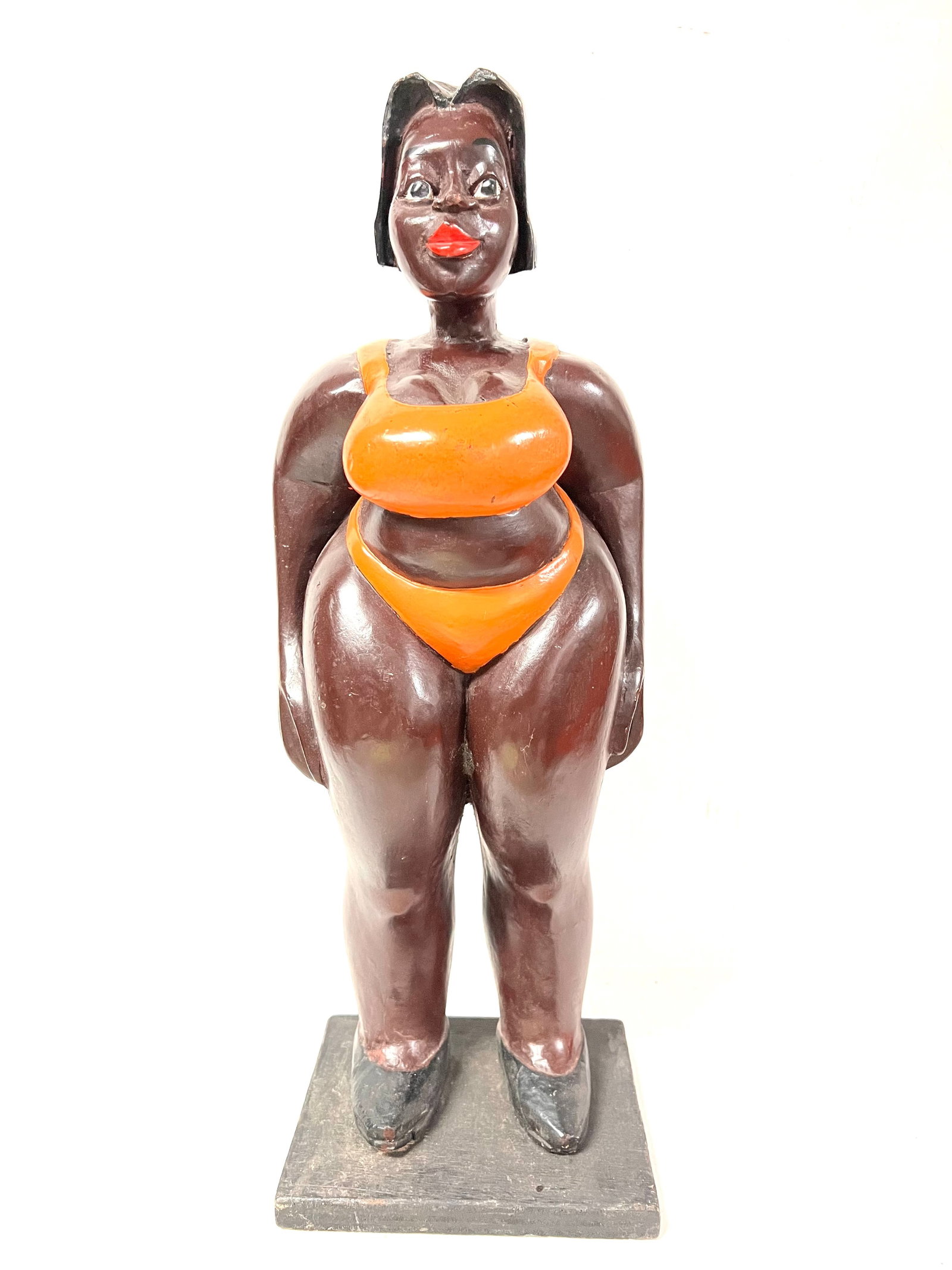 Colonial Female Statue: Title: Colonial Female Statue Description: African Tribal Art Carved Wood Colonial Female Statue Materials: Wood Date/Period: Late 20th Century Size: 21" h x 8" w Reserve: $300.00 Shipping: Domestic: